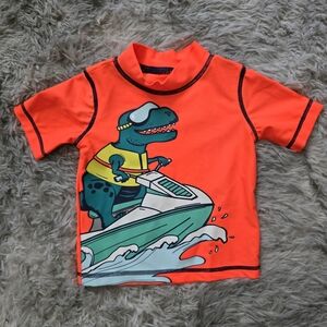 Carter's Bright Orange Rashguard with Dino on Jet Ski